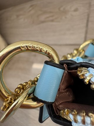 Bolso Coach azul con monedero y correa