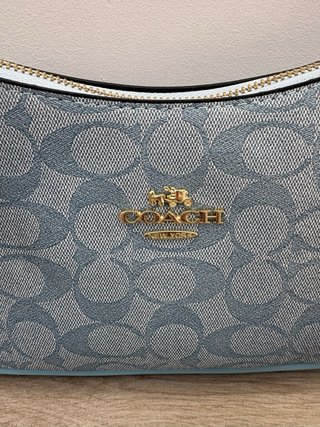 Bolso Coach azul con monedero y correa
