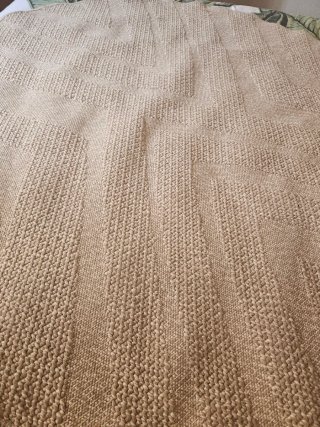 Alfombra redonda beige de tela