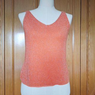 Top de punto naranja con hilos brillantes