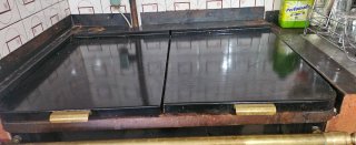 Cocina Calefactora Ergón Negra y Dorada