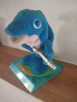 Juguete musical vintage de delfín