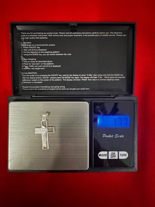 Cruz de plata con rostro de Jesús