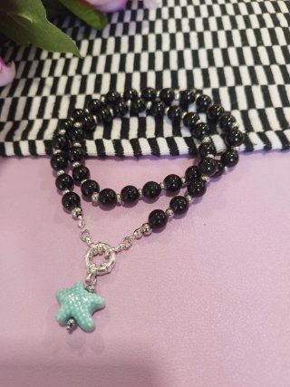 Collana perle nere con stella turchese