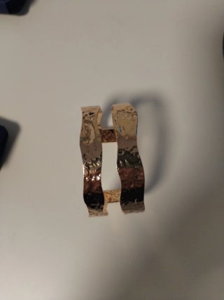 Pulsera esclava Stradivarius dorada