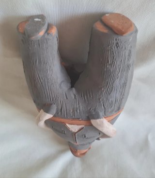 Figura rústica de barro hombre