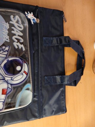 Bolsa azul con estampado de astronauta