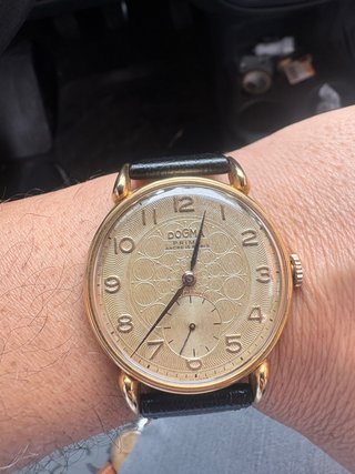 Reloj Dogma Prima de cuerda dorado
