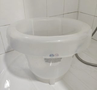 Bañera bebé anticolico vientre materno