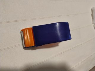 Embaladora de cinta adhesiva naranja y azul