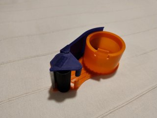 Embaladora de cinta adhesiva naranja y azul
