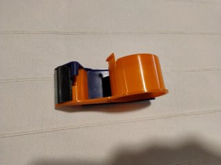 Embaladora de cinta adhesiva naranja y azul