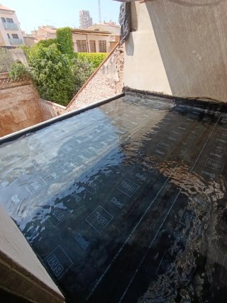 Colocador de tela asfáltica
