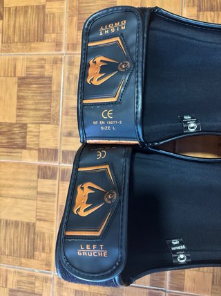 Espinilleras Venum Elite Evo Negras/Naranja