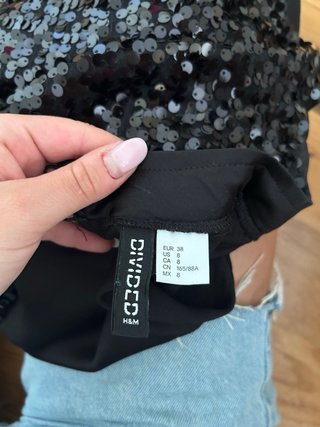 Blusa lentejuelas negra y plateada