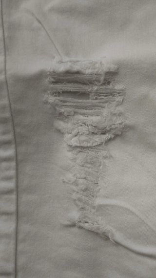 Pantaloni Madonna bianchi strappati