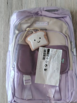 Mochila escolar morada con llavero