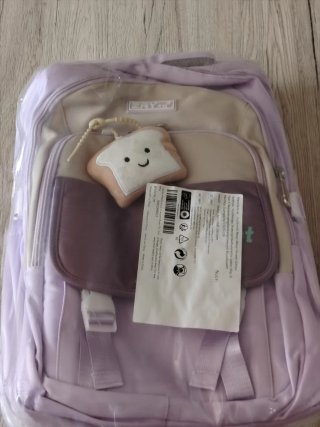 Mochila escolar morada con llavero