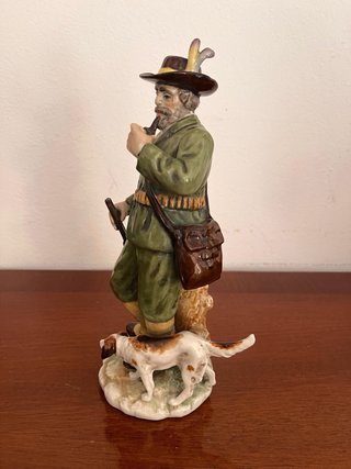 Figura de porcelana cazador y perro