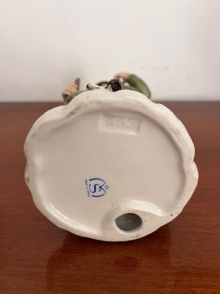 Figura de porcelana cazador y perro