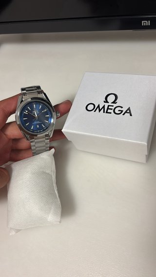 Reloj Omega Azul y Plateado