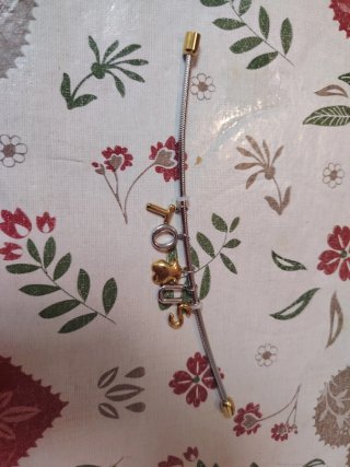 Pulsera Tous Oso y Letras Doradas/Plateadas