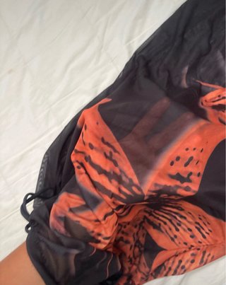 Falda transparente playa flores naranja