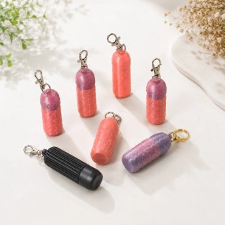 Portachiavi con design capsula portapillole