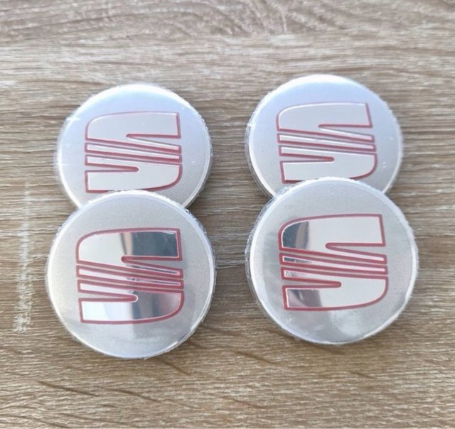Tapabujes Seat 56mm (4 unidades)