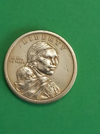 Moneda In God We Trust con mujer y bebé 1 dolar.