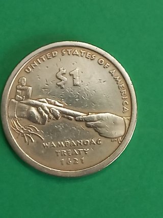 Moneda In God We Trust con mujer y bebé 1 dolar.