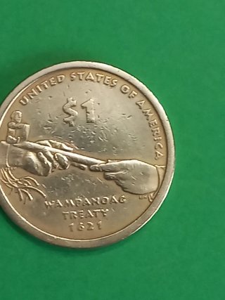 Moneda In God We Trust con mujer y bebé 1 dolar.