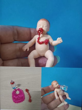 Set bebé Zuru: babero, biberón y chupete.