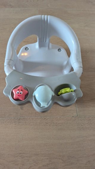 Asiento de baño para bebé con juguetes