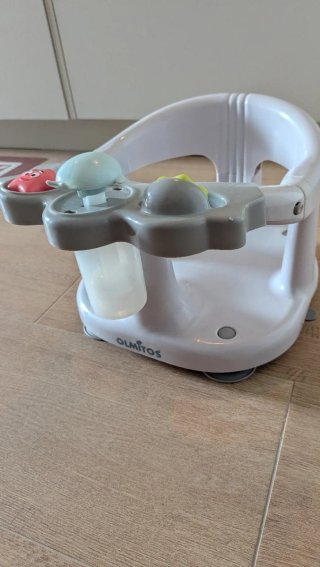 Asiento de baño para bebé con juguetes