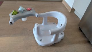 Asiento de baño para bebé con juguetes