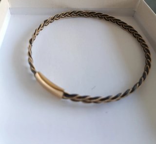 Pulsera antigua trenzada oro y negro