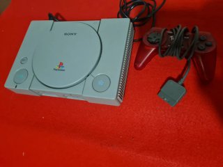Playstation 1 Sony grigio e controller rosso
