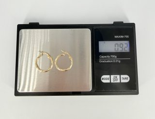 Aretes de oro de 18k. 0.92 g.