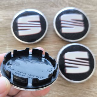 TAPABUJES SEAT 56mm NEGROS - EMBLEMA LLANTAS SEAT