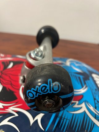 Monopatín Oxelo con diseño de mono