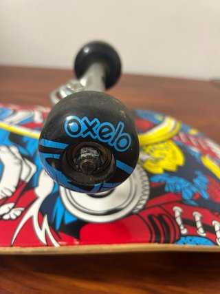 Monopatín Oxelo con diseño de mono