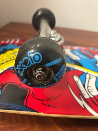 Monopatín Oxelo con diseño de mono