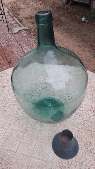 Garrafa o damajuana de vidrio verde.....