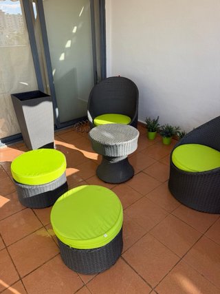 Muebles de exterior ratán negro y cojines