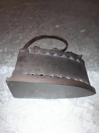 Antigua plancha de carbón