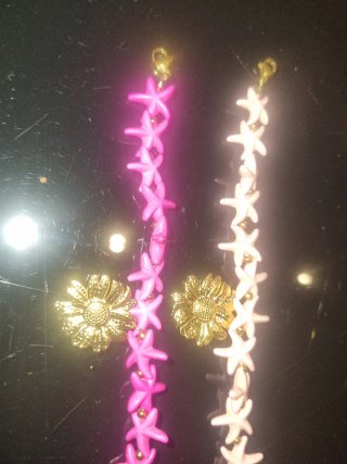 Pulseras de estrellas rosa y blancas