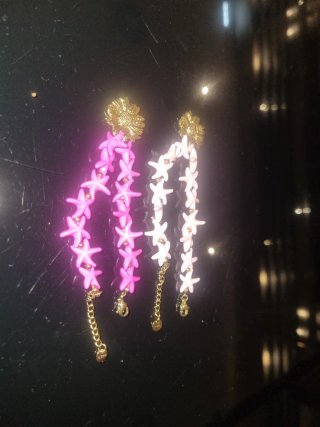 Pulseras de estrellas rosa y blancas