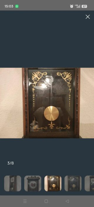 Reloj de péndulo antiguo de madera y cristal