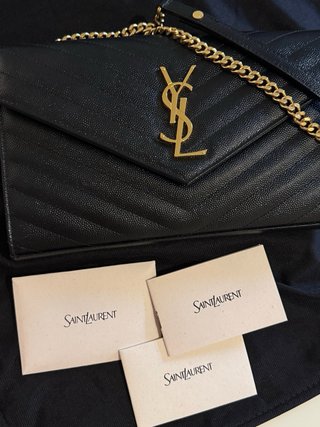 Saint Laurent Pochette con cartellino